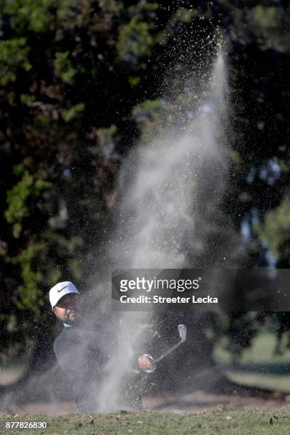 Spaun of the United States plays a shot from a bunker on the 16th hole during the final round of The RSM Classic at Sea Island Golf Club Seaside...