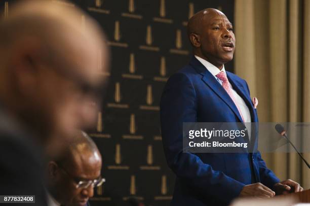 Lesetja Kganyago, governor of South Africa's central bank, right, speaks during a news conference following a Monetary Policy Committee meeting in...