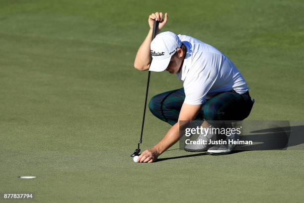 Bud Cauley of the United States lines up a putt on the 18th green during the final round of The RSM Classic at Sea Island Golf Club Seaside Course on...