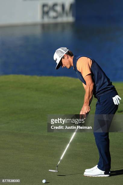 Blayne Barber of the United States putts on the 18th green during the final round of The RSM Classic at Sea Island Golf Club Seaside Course on...