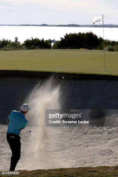 Aaron Wise of United States plays a shot from a bunker on the 13th hole during the final round of The RSM Classic at Sea Island Golf Club Seaside...