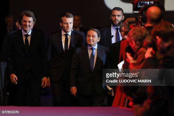 Mayor of Troyes and President of the Association of Mayors of France Francois Baroin, French President Emmanuel Macron and Mayor of Issoudun and...