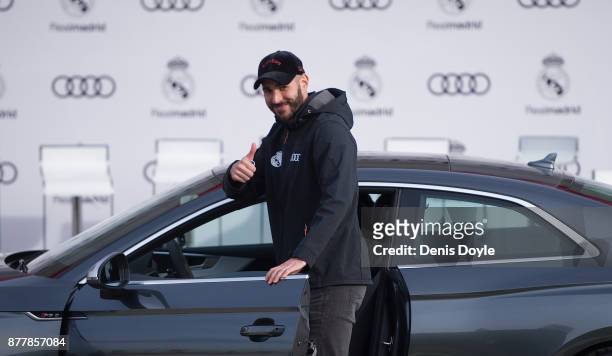 Karim Benzema of Real Madrid CF poses for a photograph after being presented with a new Audi car as part of an ongoing sponsorship deal with Real...