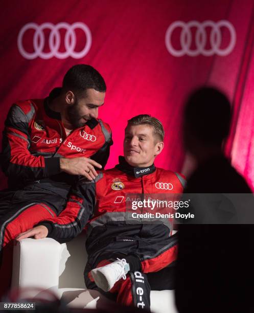 Toni Kroos of Real Madrid CF chats with his teammate Dani Carvajal after their simulated Formula e car race during the Audi Handover Sponsorship deal...