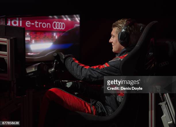 Toni Kroos of Real Madrid CF in action in his simulated car during a race with his teammates during the Audi Handover Sponsorship deal with Real...