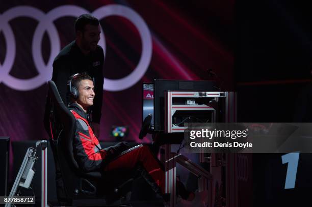 Cristiano Ronaldo of Real Madrid CF races in his simulated Formula-e car during a race with his teammates during the Audi Handover Sponsorship deal...
