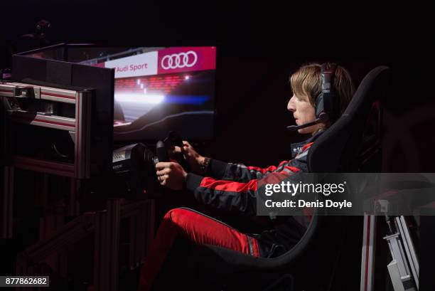 Luka Modric of Real Madrid CF races in his simulated Formula-e car during a race with his teammates during the Audi Handover Sponsorship deal with...