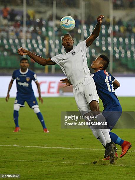 Chennaiyin FC Jeje Lalpekhlua vies for the ball with NorthEast United FC Jose Julio Gomes Goncalves during the Indian Super League football league...