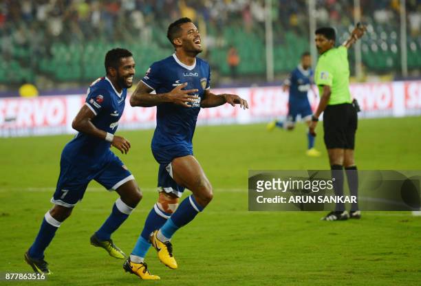 Chennaiyin FC Raphels Augusto celebrates with teammate Gergory Nelson after scoring a goal against NorthEast United FC's during the Indian Super...
