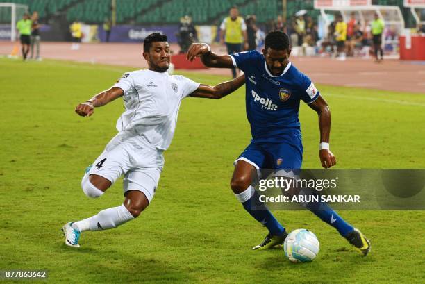 Chennaiyin FC Gergory Nelson vies for the ball with NorthEast United FC Nirmal Chettri during the Indian Super League football league match between...