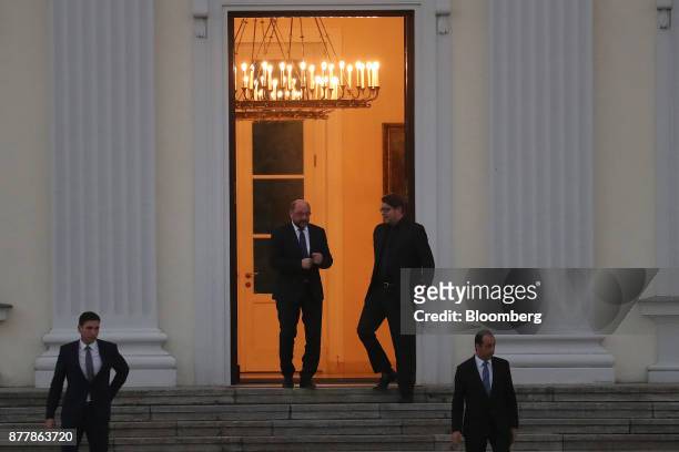Martin Schulz, leader of the Social Democrat Party , center left, and Markus Engels, campaign manager of the Social Democrat Party , depart following...