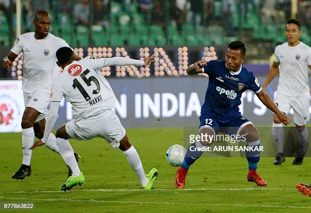 Chennaiyin FC Jeje Lalpekhlua vies for the ball with NorthEast United FC's Abdul Hakku during the Indian Super League football league match between...