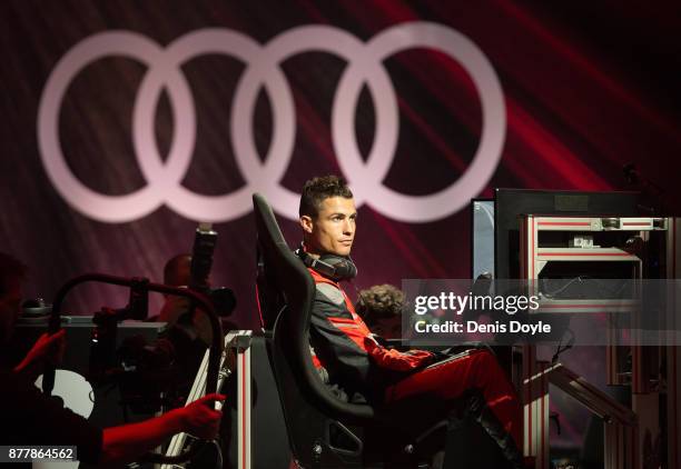 Cristiano Ronaldo of Real Madrid CF races in his simulated Formula-e car during a race with his teammates during the Audi Handover Sponsorship deal...