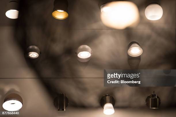 Philips LED lighting sits illuminated on a wall at the Philips Lighting NV experience center in Eindhoven, Netherlands, on Thursday, Nov. 23, 2017....