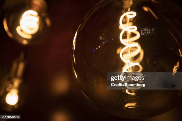 Filaments glow inside Philips Classic LED light bulbs at the Philips Lighting NV experience center in Eindhoven, Netherlands, on Thursday, Nov. 23,...