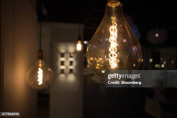 Filaments glow inside Philips Classic LED light bulbs at the Philips Lighting NV experience center in Eindhoven, Netherlands, on Thursday, Nov. 23,...