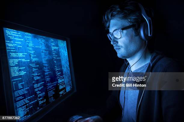 man coding at seattle office - bill hinton stock pictures, royalty-free photos & images