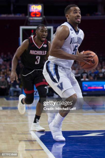 Phil Booth of the Villanova Wildcats drives to the basket against Lafayette Rutledge of the Nicholls State Colonels at the Wells Fargo Center on...