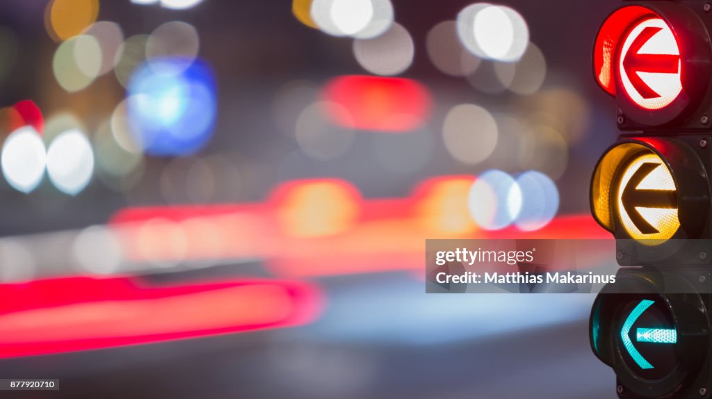 Urban City Street Szene with colorful Traffic Lights and Bokeh Night Lights