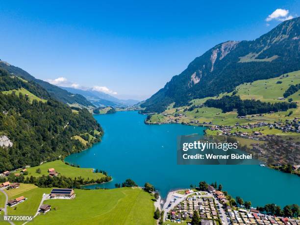 lungern village and its lake bird eyes view - lungern switzerland stock-fotos und bilder