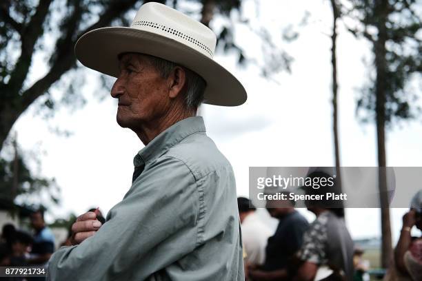 Families wait for food to be served at the annual Thanksgiving in the Park gathering where residents of the farm worker community of Immokalee are...