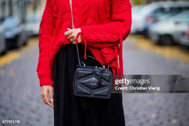 Alessa Winter wearing red knit Bershka, black Laurel bag, black midi skirt Naked, black Dr. Martens boots on November 23, 2017 in Berlin, Germany.