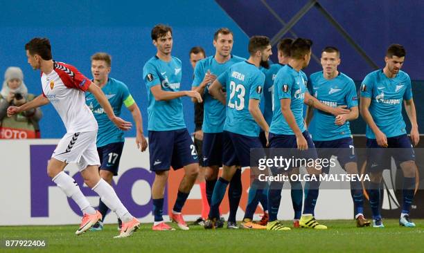 Zenit's players celebrate the opening goal during the UEFA Europa League Group L football match between FC Zenit and FK Vardar in Saint Petersburg on...