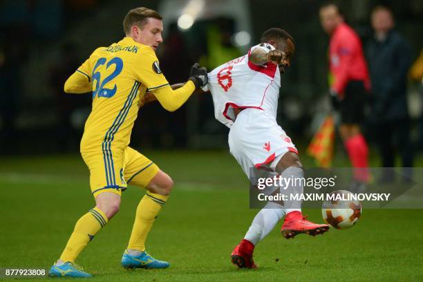 Borisov's forward from Belarus Mikhail Gordeychuk and Crvena Zvezda Beograd's midfielder from Gabon Guelor Kanga Kakou vie for the ball during the...