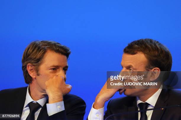 French President Emmanuel Macron and Mayor of Troyes and President of the Association of Mayors of France Francois Baroin speak during the 100th...