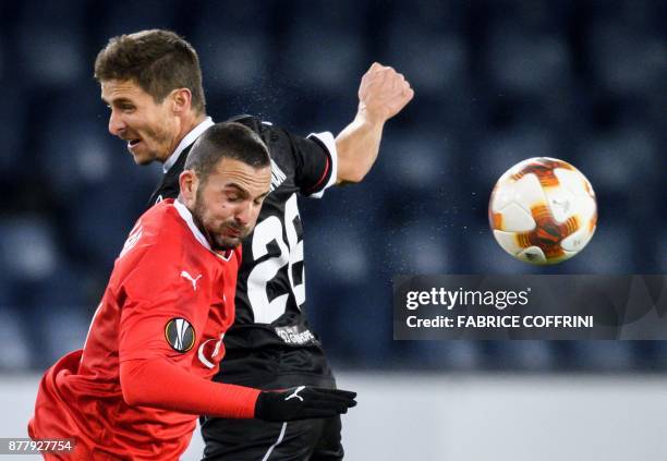 Hapoel Beer Sheva's forward from Israel Ben Sahar fights for the ball with Lugano's Swiss defender Fulvio Sulmoni during the UEFA Europa League Group...
