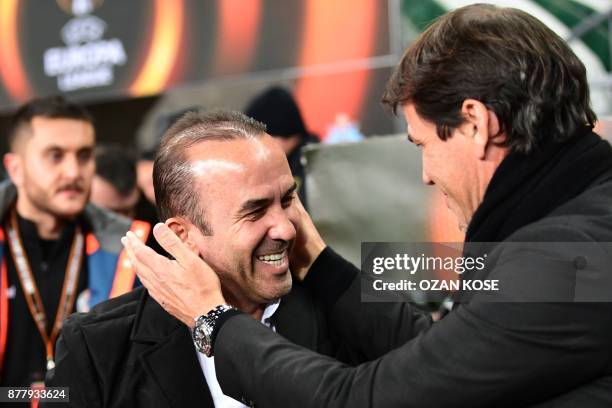 Konyaspor's Turkish head coach Mehmet Ozdilek greets Olympique de Marseille's French head coach Rudi Garcia during the UEFA Europa League Group I...