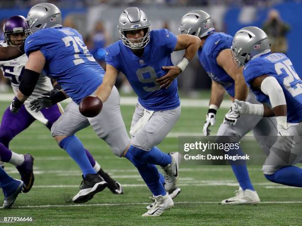 Quarterback Matthew Stafford of the Detroit Lions looks to hand off the football against the Minnesota Vikings during the first half at Ford Field on...