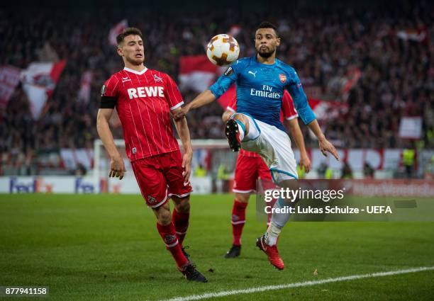 Francis Coquelin of Arsenal and Salih Oezcan of Koeln fight for the ball during the UEFA Europa League group H match between 1. FC Koeln and Arsenal...