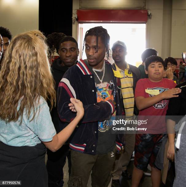 Travis Scott helps distribute clothing during the Houston City Wide Club of Clubs Turkey Drive on November 23, 2017 in Houston, Texas.