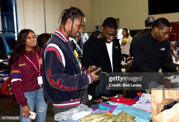 Travis Scott helps distribute clothing during the Houston City Wide Club of Clubs Turkey Drive on November 23, 2017 in Houston, Texas.