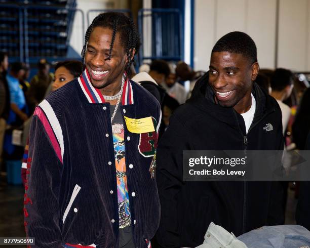 Travis Scott helps distribute clothing during the Houston City Wide Club of Clubs Turkey Drive on November 23, 2017 in Houston, Texas.