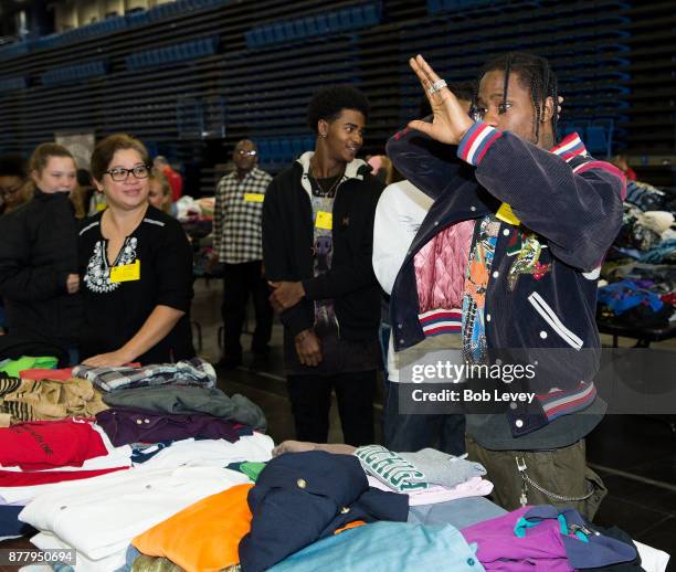 Travis Scott helps distribute clothing during the Houston City Wide Club of Clubs Turkey Drive on November 23, 2017 in Houston, Texas.