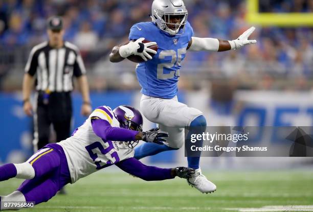 Theo Riddick of the Detroit Lions runs against Terence Newman of the Minnesota Vikings during the third quarter at Ford Field on November 23, 2017 in...