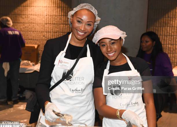 Personality Cynthia Bailey with her daughter Noelle Robinson attend Hosea Helps' 48th Annual Thanksgiving Dinner at Georgia World Congress Center on...