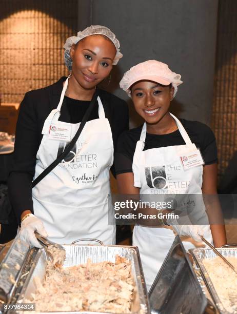 Personality Cynthia Bailey with her daughter Noelle Robinson attend Hosea Helps' 48th Annual Thanksgiving Dinner at Georgia World Congress Center on...