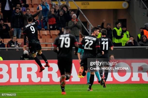 Milan's Portuguese forward Andre Silva celebrates after scoring the UEFA Europa League group D football match between AC Milan and FK Austria-Wien at...