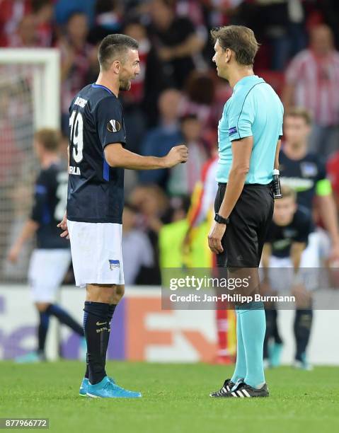 Vedad Ibisevic of Hertha BSC and referee Paolo Tagliavento after the game between Athletic Bilbao and Hertha BSC at San Mames Stadium on November 23,...