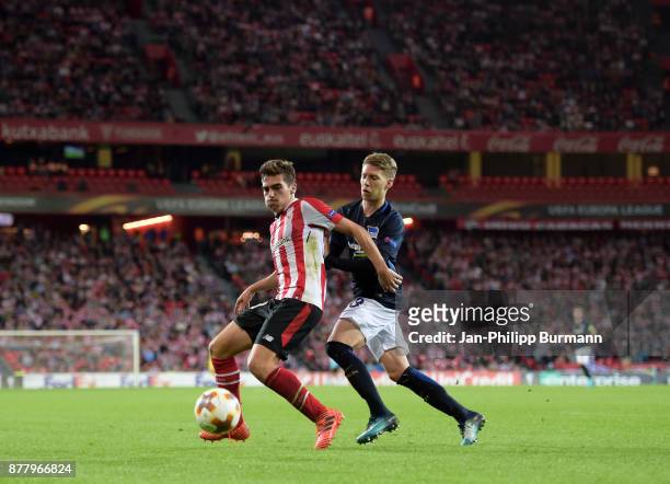 Inigo Cordoba of Athletic Bilbao and Mitchell Weiser of Hertha BSC during the game between Athletic Bilbao and Hertha BSC at San Mames Stadium on...