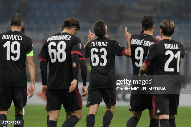 Milan's Italian forward Patrick Cutrone celebrates after scoring during the UEFA Europa League group D football match between AC Milan and FK...