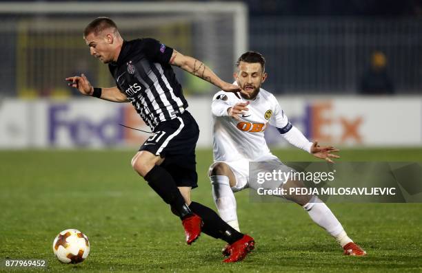 Partizan's Ognjen Ozegovic vies with Young Boys' Miralem Sulejmani during the UEFA Europa League football match between Partizan Belgrade and BSC...