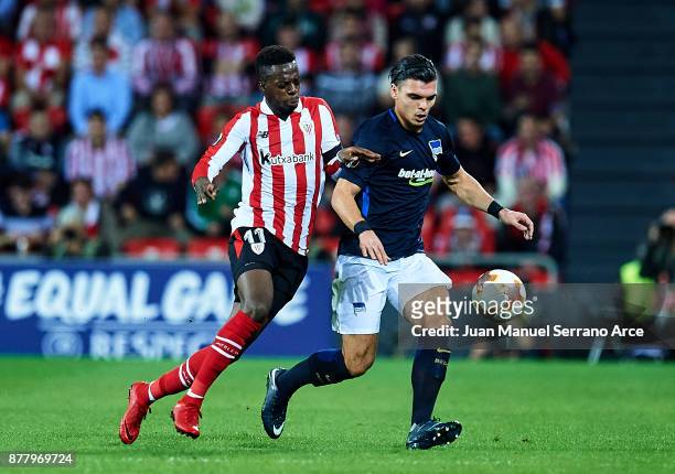Inaki Willams of Athletic Club duels for the ball with Karim Rekik of Hertha BSC during the UEFA Europa League group J match between Athletic Bilbao...