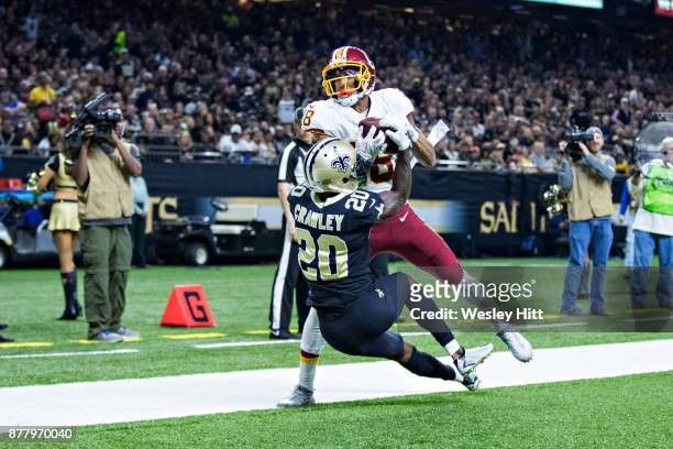 Josh Doctson of the Washington Redskins goes up for a pass in the end zone but lands out of bounds against Ken Crawley of the New Orleans Saints at...