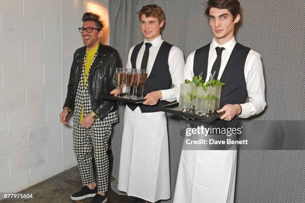 Henry Holland and waiters attend an intimate dinner hosted by Henry Holland and Andrew Nugent to celebrate the House of Holland Resort 18 collection...