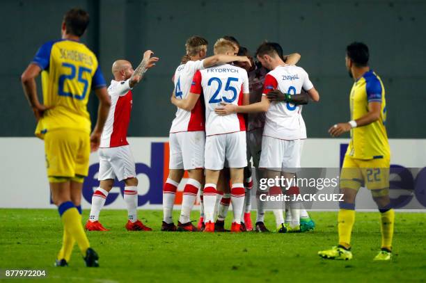 Slavia's players celebrate their second goal during the Europa League Group A football match between Maccabi Tel Aviv and Slavia Prague on November...