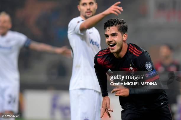 Milan's Portuguese forward Andre Silva celebrates after scoring during the UEFA Europa League group D football match between AC Milan and FK...